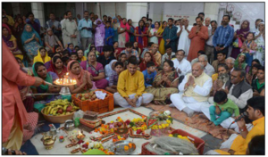 An image of Puja Archanam in a Hindu community.png