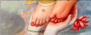 Krishna touches Radha's feet.png